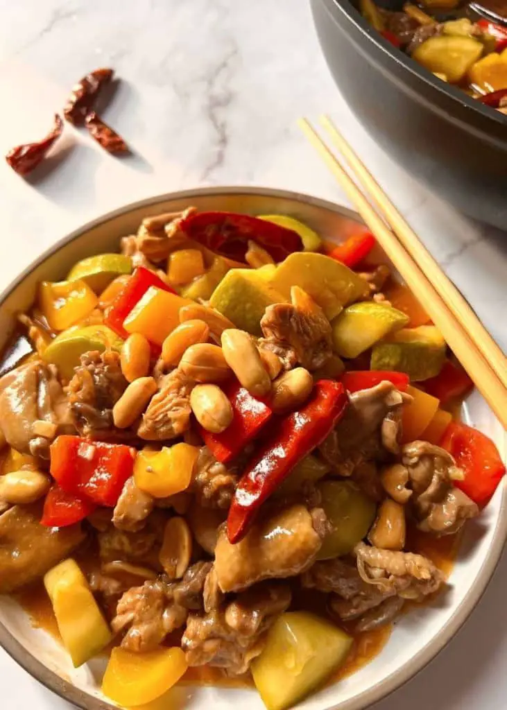 The healthy version of Panda Express Kung Pao Chicken is a fat-free one-pot meal. You don't have to add any oil in this quick recipe. Together with homemade Kung Pao Sauce, you can enjoy a low-calorie, healthy, lightly spiced and salty Kung Pao Chicken better than Panda Express in a short time.