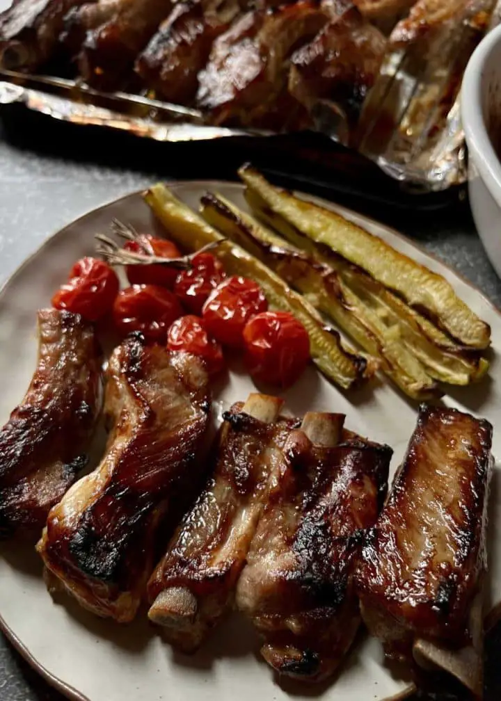 pork ribs with cherry tomato and zucchini